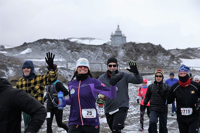 Runners posing during the Antarctica Marathon 2025