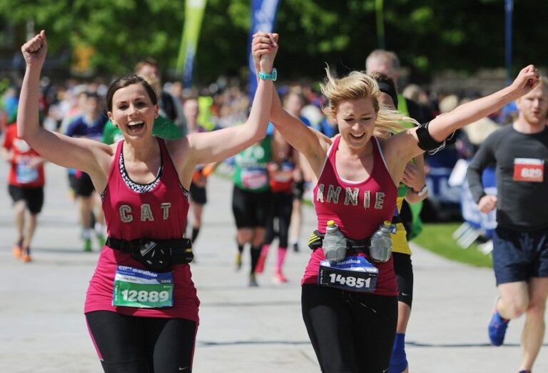Photo of runners crossing the finishing line of the Edinburgh Marathon 2025
