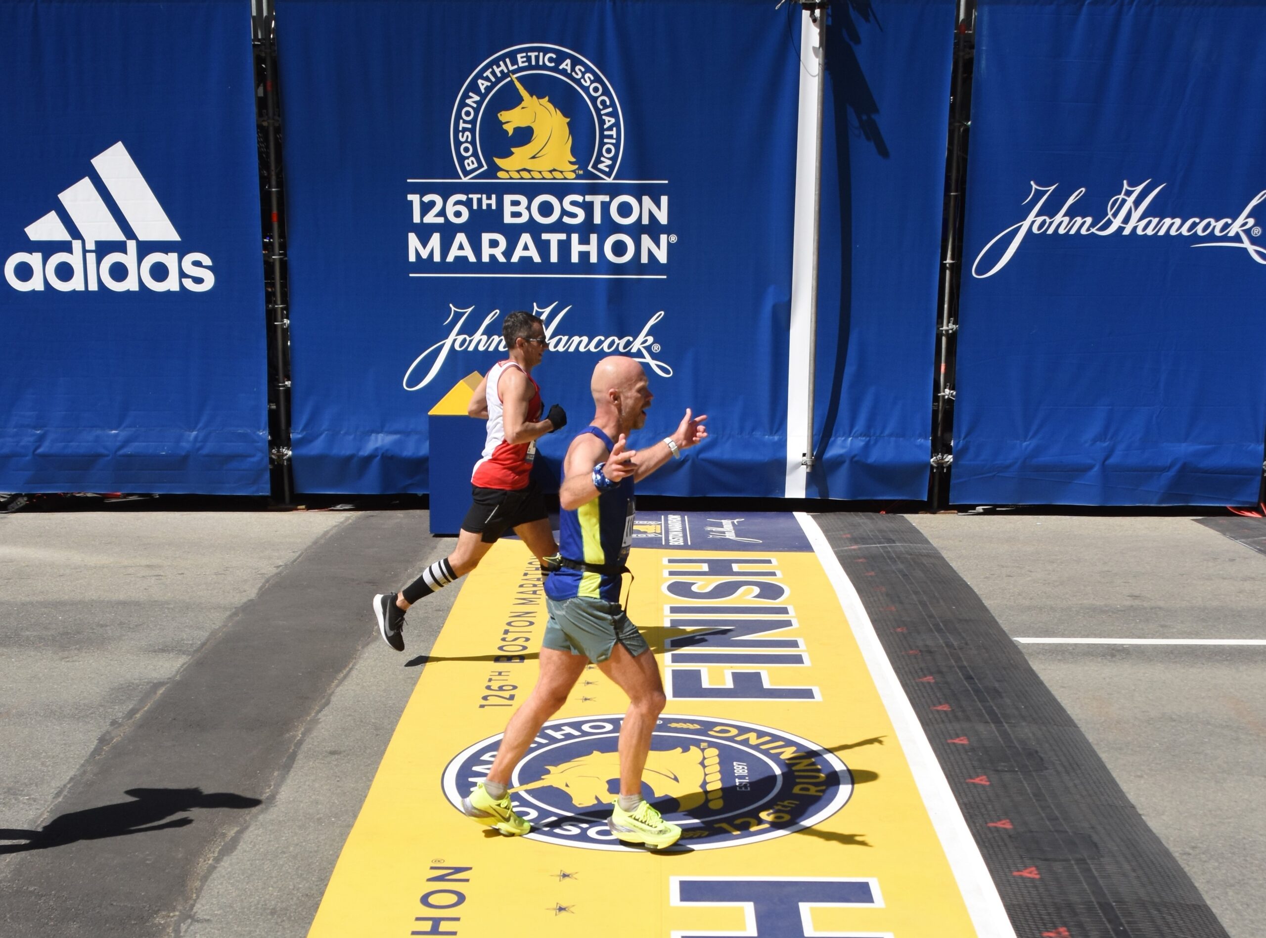Photo of runners crossing the finish line at Boston Marathon 2025