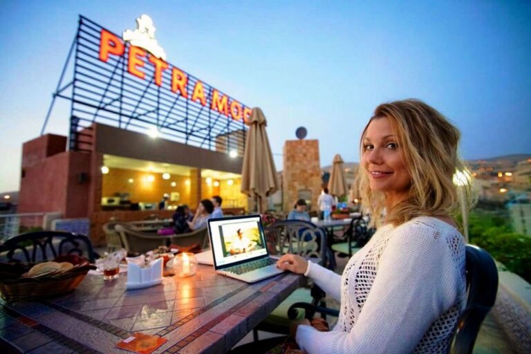 A traveller relaxes outside the Petra Moon, hotel option for the Petra Desert Marathon 2024