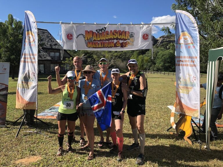 Runners celebrating finishing the Madagascar Marathon 2024