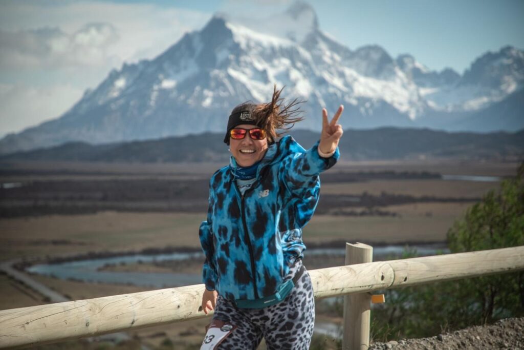 A runner poses to camera during a Seven Continents Club event