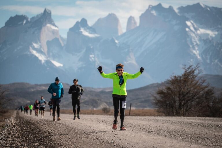 A runner celebrates whilst taking part in the Patagonia Marathon 2025