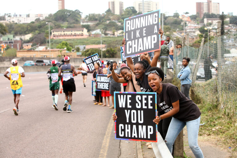 Photo of spectators encouraging runners at the Comrades Marathon 2025